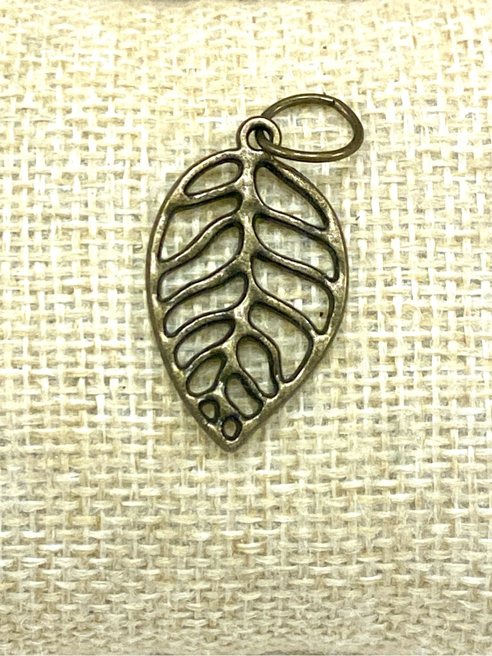 Delicate Leaf Cutout Pendant in Antique Brass